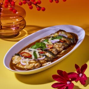 Slow-Poached Barramundi (locally sourced) with Assam Laksa Sauce topped with Pineapple Cucumber Kerabu