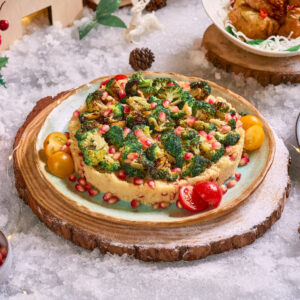 Cous Cous and Broccoli Floret Salad with Pomegranate topped with Thai Green Lime Chilli Dressing